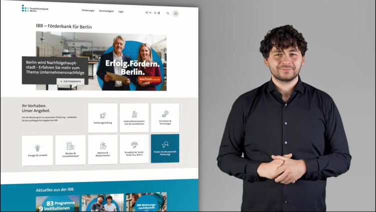 
Standbild des Videos in Deutscher Gebärdensprache mit einem Gebärdensprecher, Inhalt: Erklärung der Navigation
